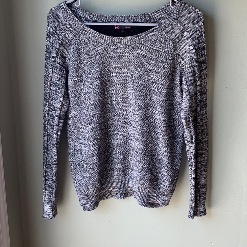 Grey sweater with black and white striped back